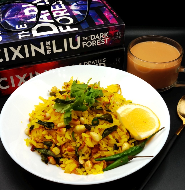  A plate of freshly prepared Kanda Poha topped with cilantro and peanuts.