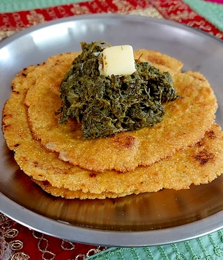 Image of freshly cooked Makki Ki Roti, served with sarson da saag.