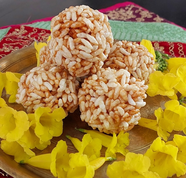 Murmura laddoos is served in brass plate. Easy and Healthy Murmura Laddoo Recipe - Delicious homemade snack.